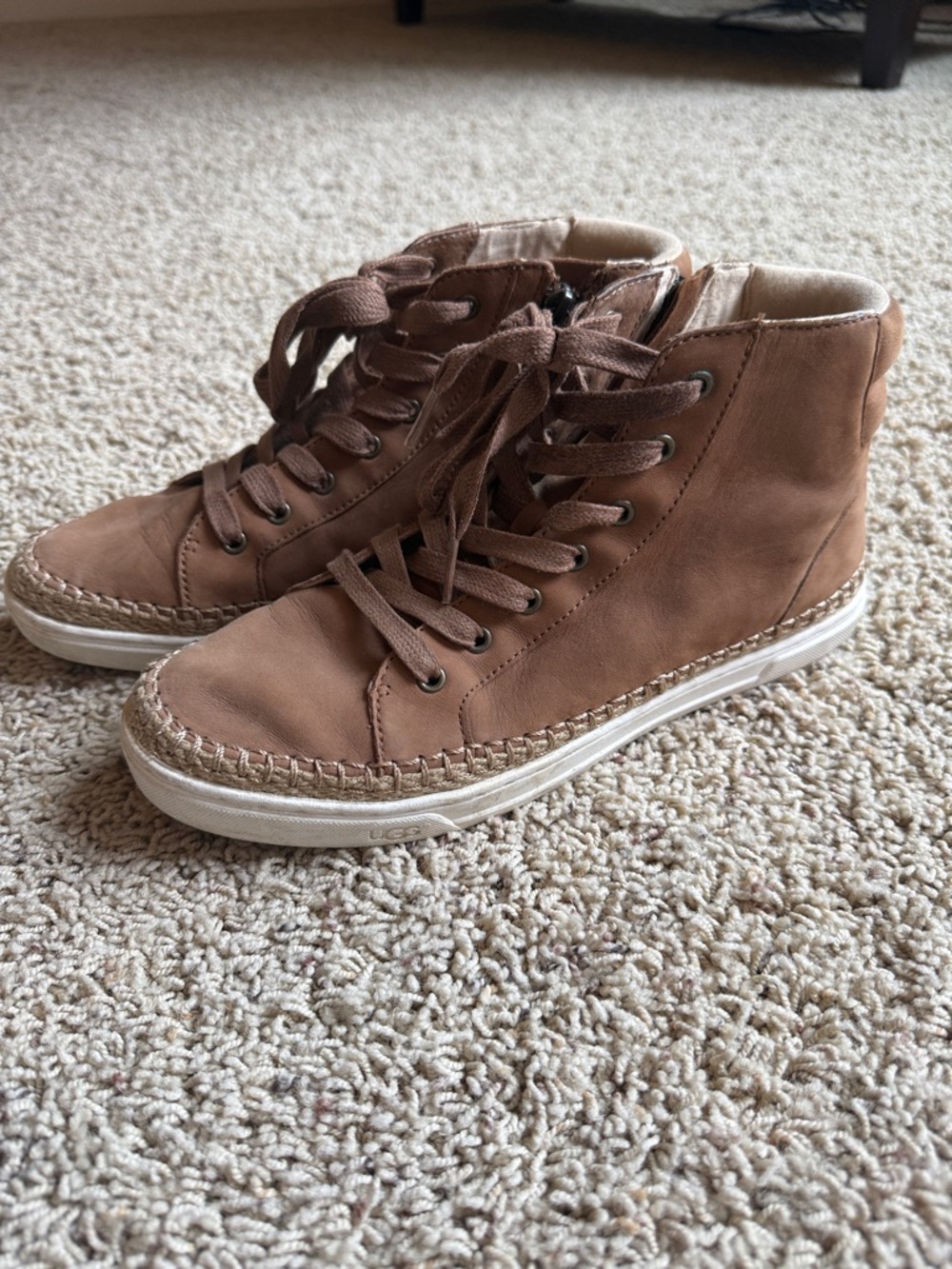 Ugg women’s side zip ankle booties in tan leather.